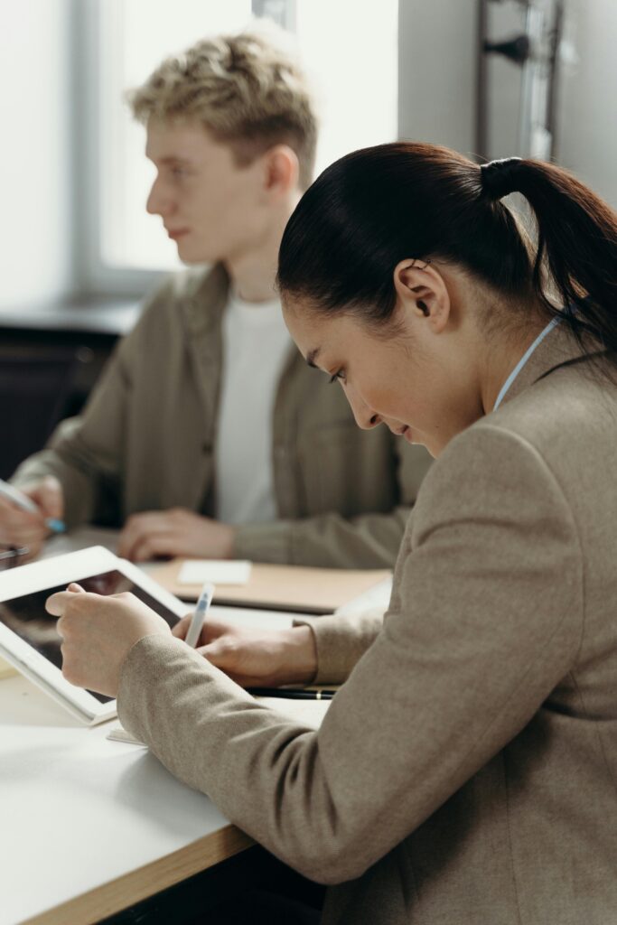 Chinese lady reading in a meeting