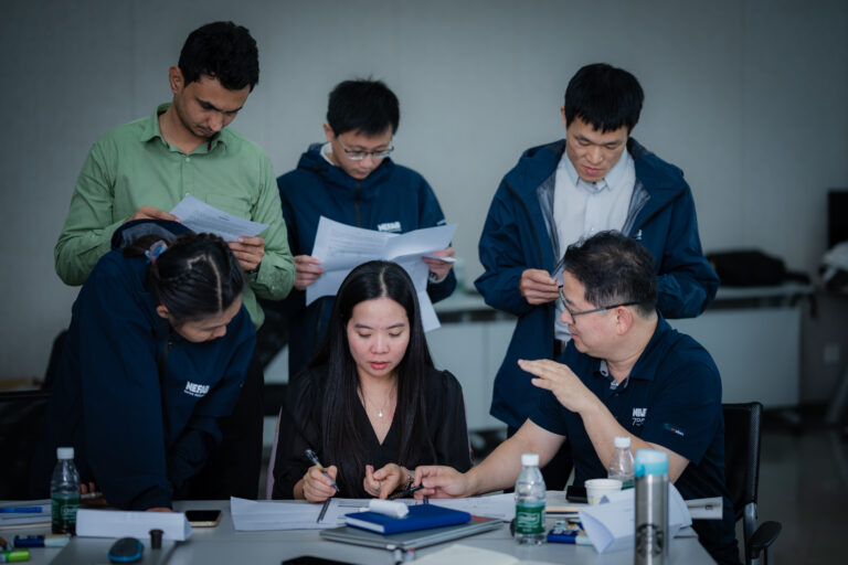 Participants preparing for a meeting