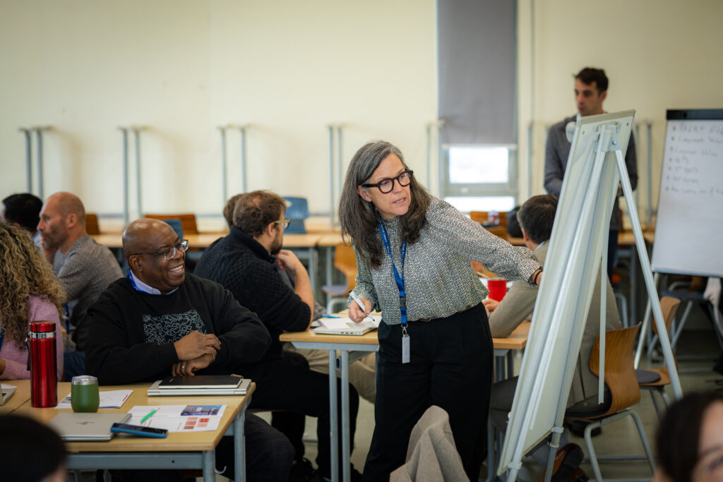 Training participant writing on a whiteboard
