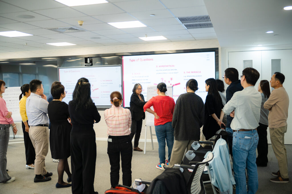 Participants are listening to the coach