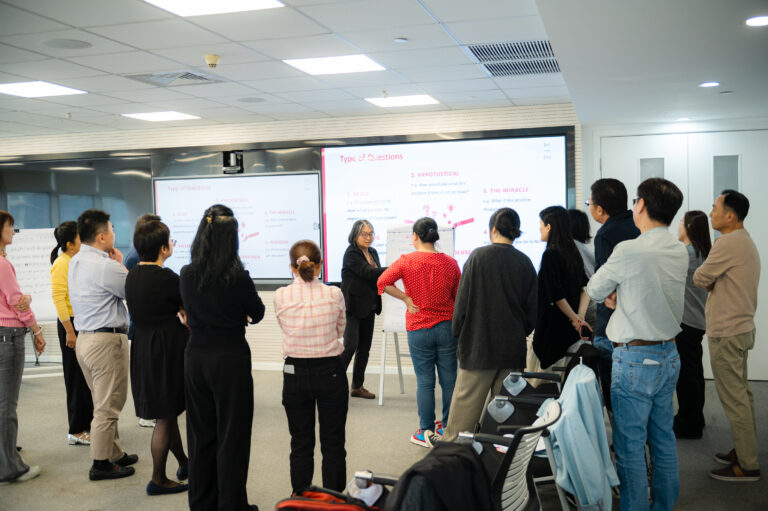 Participants are listening to the coach