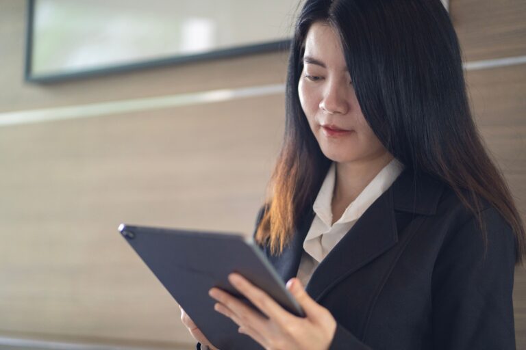 Lady looking at her tablet